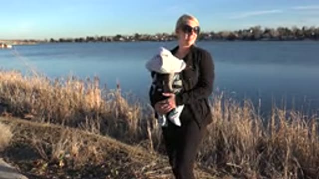 WESTMINSTER COLORADO-2015: Woman Holds Child While Admiring Nature