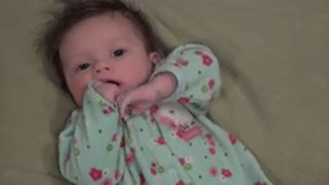 WESTMINSTER COLORADO-2015: A Cute Little Baby Playing With Her Fingers In Her Mouth