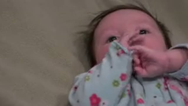 WESTMINSTER COLORADO-2015: Baby Lying On The Bed Moving Waving His Hands