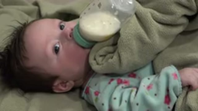 WESTMINSTER COLORADO-2015: A White Baby Drinking Milk From Bottle While Sleeping