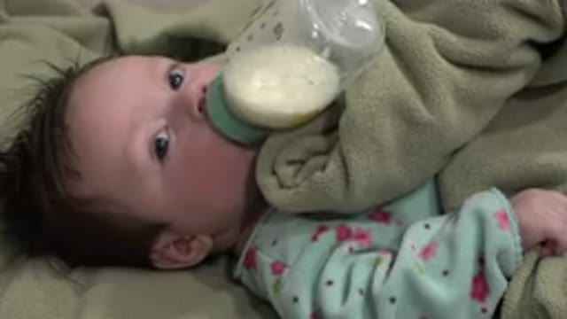 WESTMINSTER COLORADO-2015: A Baby With Wet Blond Hair and Blue Eyes Sucking Bottle