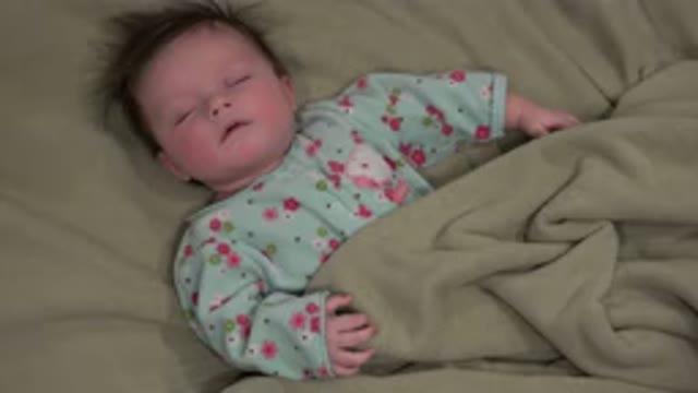 WESTMINSTER COLORADO-2015: Still Image Of A Baby Laying On A Bed Sleeping
