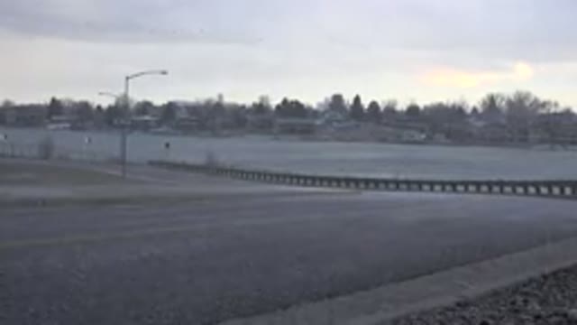 WESTMINSTER COLORADO-2015: Hailstones Falling On Empty Street On A Cloudy Day