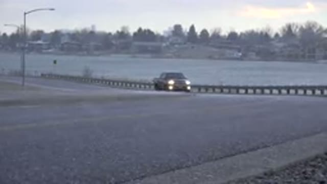 WESTMINSTER COLORADO-2015: Vehicle In The Rain Makes Slow Turn To The Right On