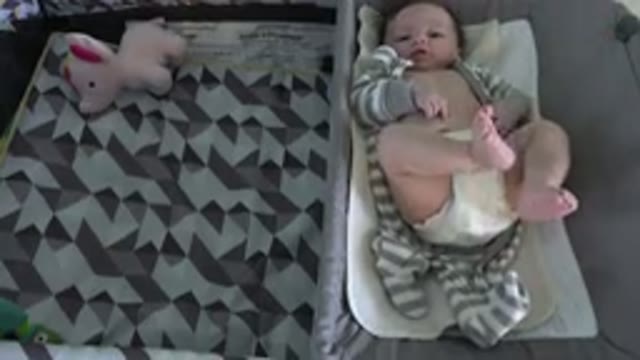 WESTMINSTER COLORADO-2015: Baby in Gray and White Sleeper Lies in Bassinet