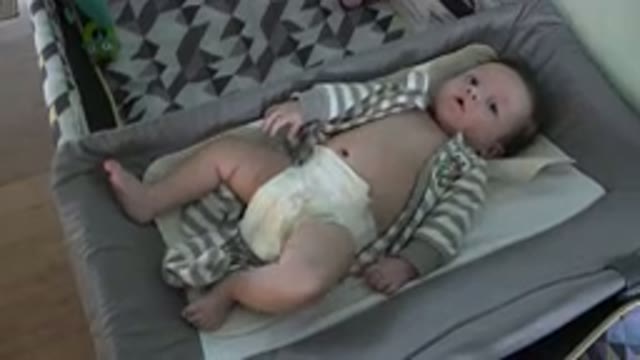 WESTMINSTER COLORADO-2015: A Baby Lying On A Changing Pad
