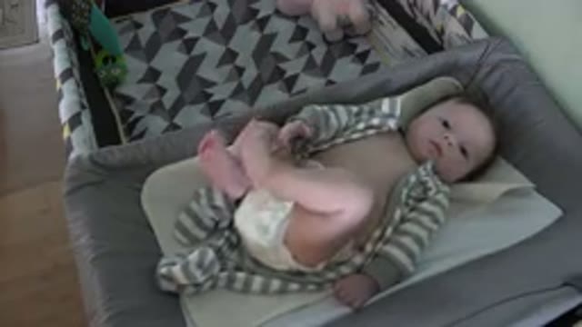WESTMINSTER COLORADO-2015: Baby Wearing Gray and White Sleeper Lies in Bassinet