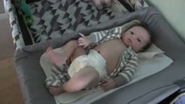 WESTMINSTER COLORADO-2015: Baby Kicking and Reaching in Cot Partially Dressed