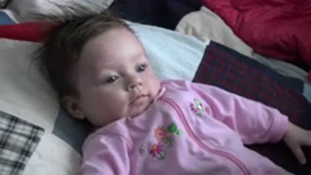 WESTMINSTER COLORADO-2015: A Young Baby With Brown Hair Is Looking Around While