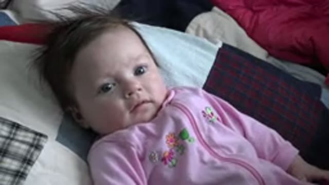 WESTMINSTER COLORADO-2015: Baby Laying On A Bed And Looking Around And Staring