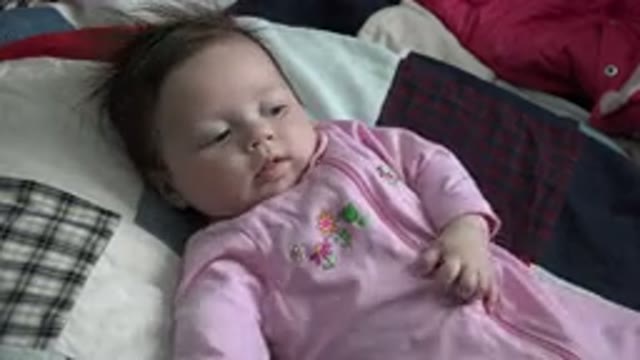 WESTMINSTER COLORADO-2015: Baby Lying On Bed Restlessly Moving Sideways