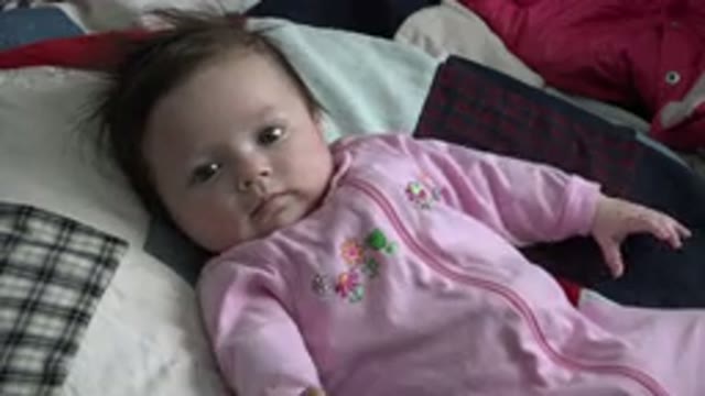 WESTMINSTER COLORADO-2015: Baby On A Patchwork Quilt Staring At The Camera
