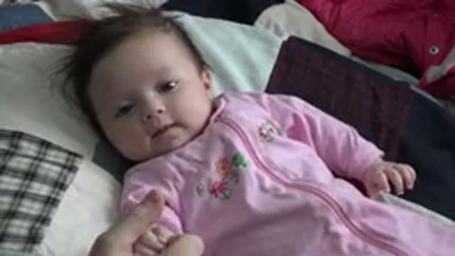 WESTMINSTER COLORADO-2015: Baby On A Patchwork Quilt Looking At Camera