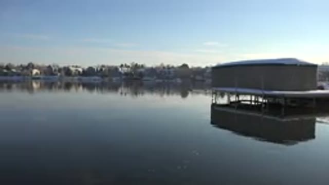 WESTMINSTER COLORADO-2015: Tan Structure On White Platform Over Calm Water On A
