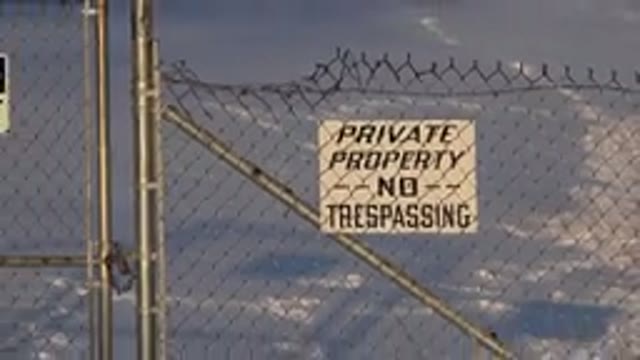 WESTMINSTER COLORADO-2015: Zoom Out Shot Of Fence With Warning And Private Signs