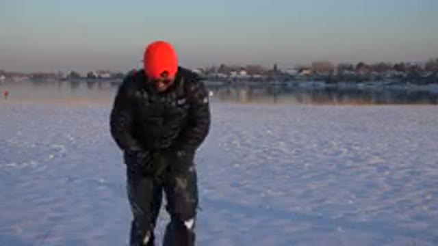 WESTMINSTER COLORADO-2015: A Man Getting Up From A Kneeling Position In The Snow
