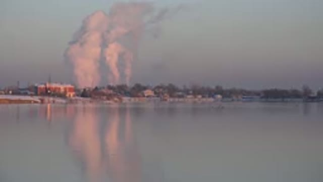 WESTMINSTER COLORADO-2015: White Smoke Rising From Winter City Into Blue-Gray