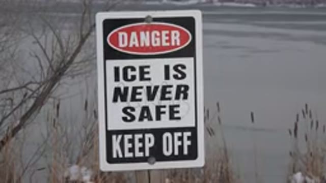 WESTMINSTER COLORADO-2015: Danger Sign About Unsafe Ice Near A Lake With Trees