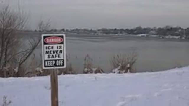 WESTMINSTER COLORADO-2015: Sign In Front Of Frozen Lake In Snow Warns That Ice