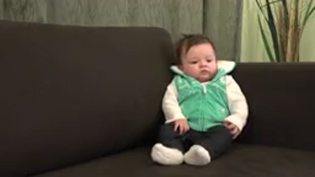 WESTMINSTER COLORADO-2015: Baby Sitting On The Couch Moving His Hands And Opening Mouth