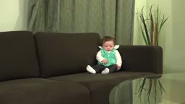 WESTMINSTER COLORADO-2015: Baby Alone on Sofa Moving Arms and Legs
