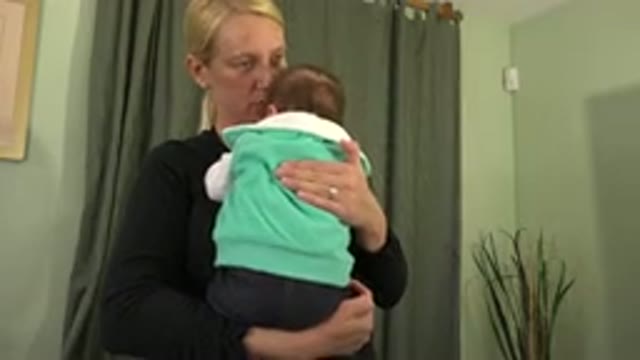 WESTMINSTER COLORADO-2015: Woman Putting Her Baby To Sleep