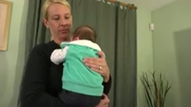 WESTMINSTER COLORADO-2015: Blonde Woman in Black Clothes Cradling Baby in Arms