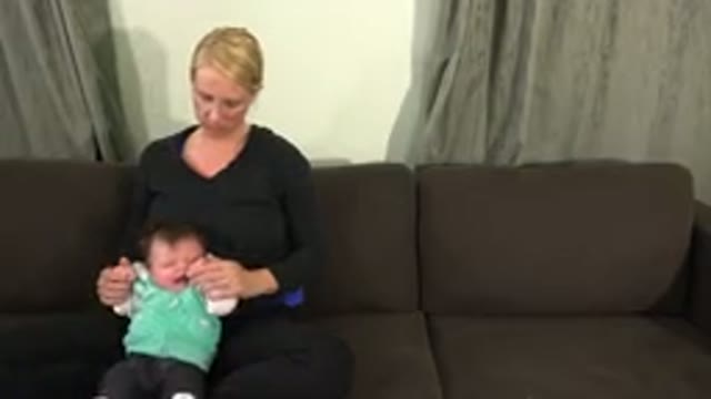 WESTMINSTER COLORADO-2015: Blonde Woman On Couch Comforting Crying Baby
