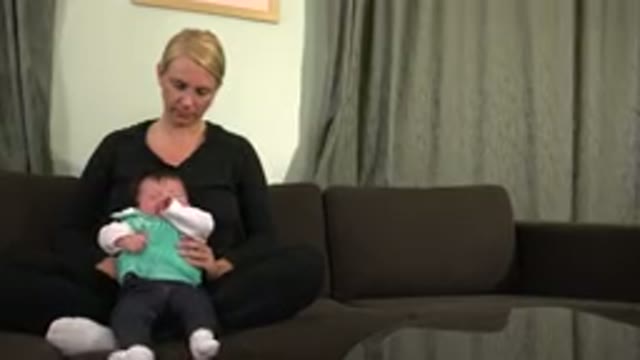 WESTMINSTER COLORADO-2015: Woman Dressed In Black With Baby Moving On Her Lap
