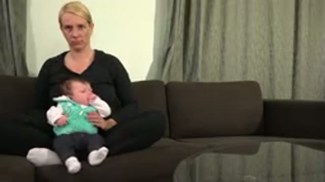 WESTMINSTER COLORADO-2015: A Baby Girl Crying On The Lap Of A Woman