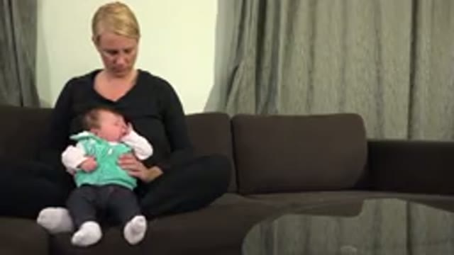 WESTMINSTER COLORADO-2015: Woman Smiling While Baby Moves On Her Lap