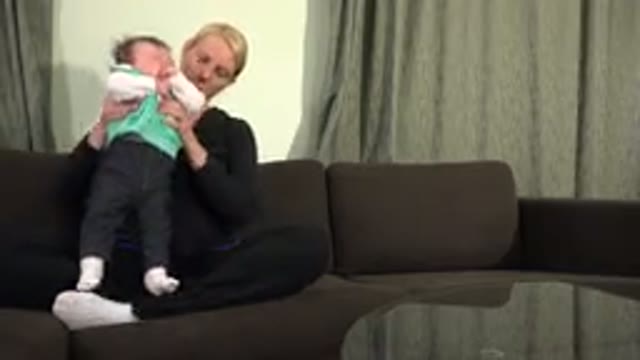 WESTMINSTER COLORADO-2015: Woman Talking Trying To Calm The Crying Baby On The