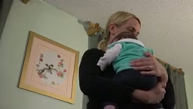 WESTMINSTER COLORADO-2015: An Older Woman Trying To Rock A Baby