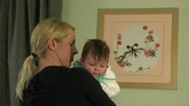 WESTMINSTER COLORADO-2015: Blonde Woman Holding A Small Brunette Child With A