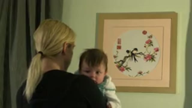 WESTMINSTER COLORADO-2015: Blonde Woman With Baby On Her Lap Child Staring