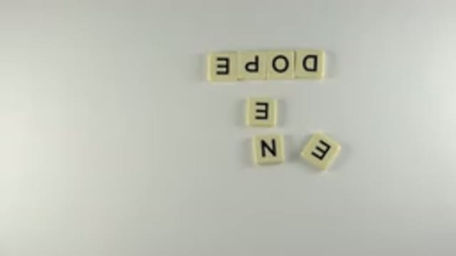 WESTMINSTER COLORADO-2015: Hand Using Scrabble Tiles To Spell Eâ¬Need Dopeâ¬