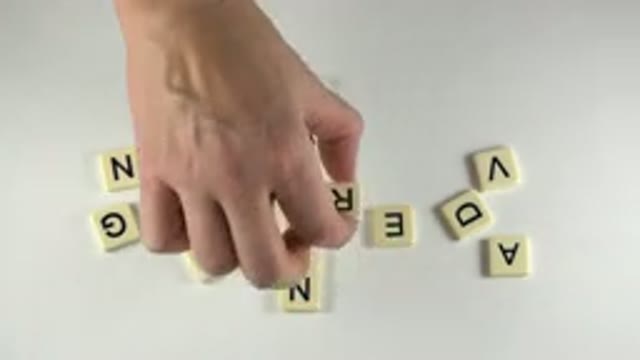 WESTMINSTER COLORADO-2015: Someone Arranging Scrabble Letters And Unscrambling