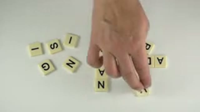 WESTMINSTER COLORADO-2015: A Person Plays With Letter Tiles Forming Words
