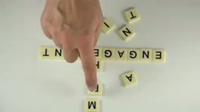 WESTMINSTER COLORADO-2015: Hand Arranges Scrabble Letters to Spell Word