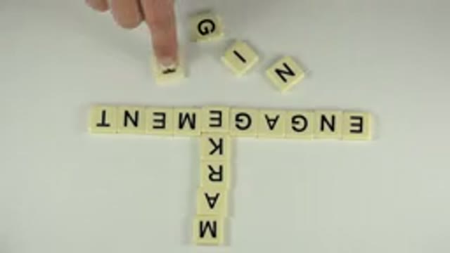 WESTMINSTER COLORADO-2015: A Hand With A French Manicure Skillfully Placing Scrabble Tiles