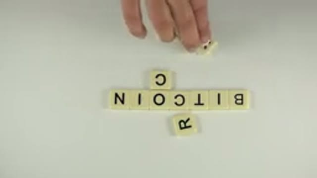 WESTMINSTER COLORADO-2015: Person Creating Horizontal And Vertical Words With Scrabble Tiles