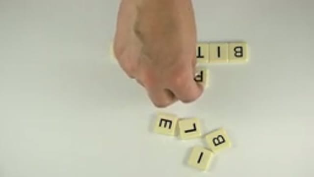 WESTMINSTER COLORADO-2015: A Man Arranging Letter Tiles To Create Words In A
