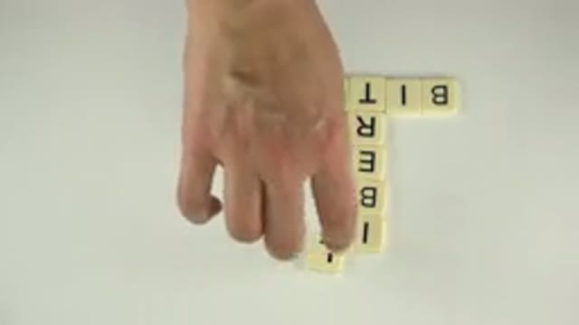 WESTMINSTER COLORADO-2015: A Person Spells A Word With Tiled Letters