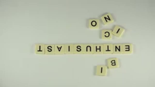 WESTMINSTER COLORADO-2015: Scrabble Game With Person Pointing and Moving Pieces