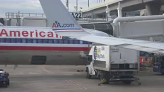 PLAYA DEL CARMEN MEXICO-2015: Loading Truck Parked On Tarmac Near Plane Slowly Closes Rear Door