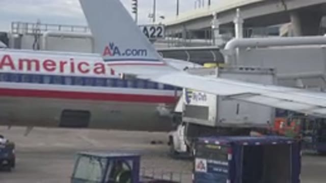 PLAYA DEL CARMEN MEXICO-2015: Passenger Airliner Being Loaded With Cargo Via A