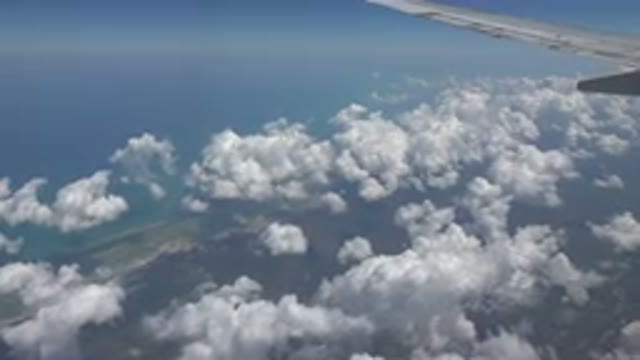PLAYA DEL CARMEN MEXICO-2015: Aerial Blue Sky And White Clouds On A Clear Sunny