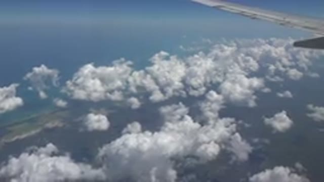 PLAYA DEL CARMEN MEXICO-2015: The Edge Of A Plane As The Plane Goes Through The Sky