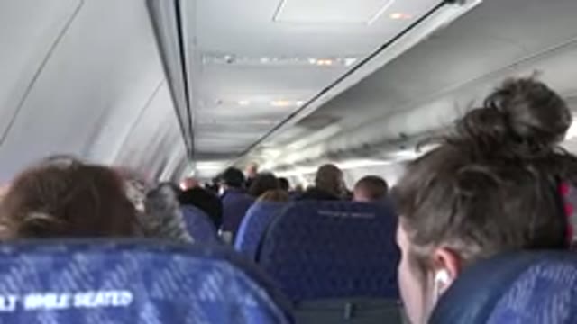 PLAYA DEL CARMEN MEXICO-2015: Passenger Seated in Airplane Interior