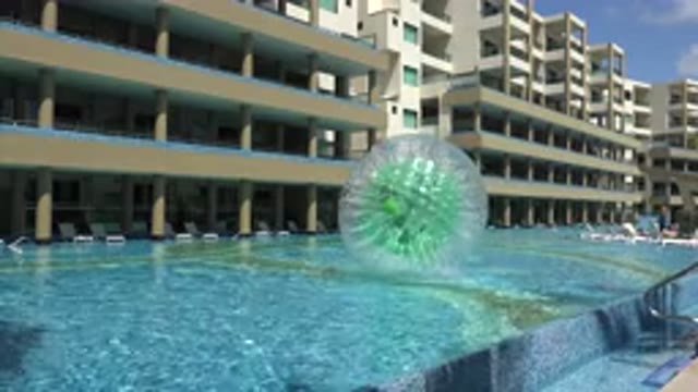 PLAYA DEL CARMEN MEXICO-2015: A Person Inside A Balloon Rolling The Balloon On